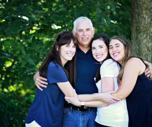 Mike Sargent with his wife and two daughters in a nice family photo.