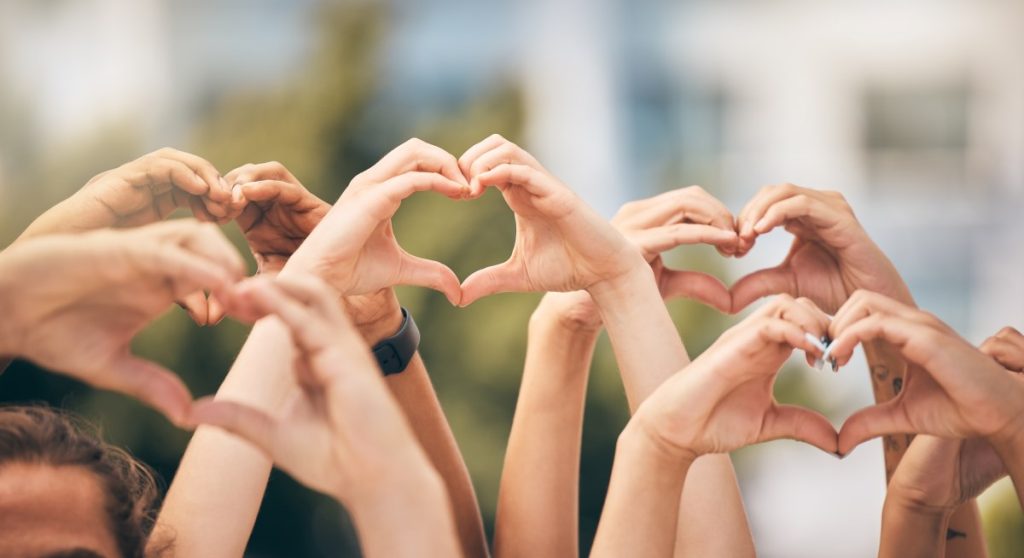 Hands holding up heart hands