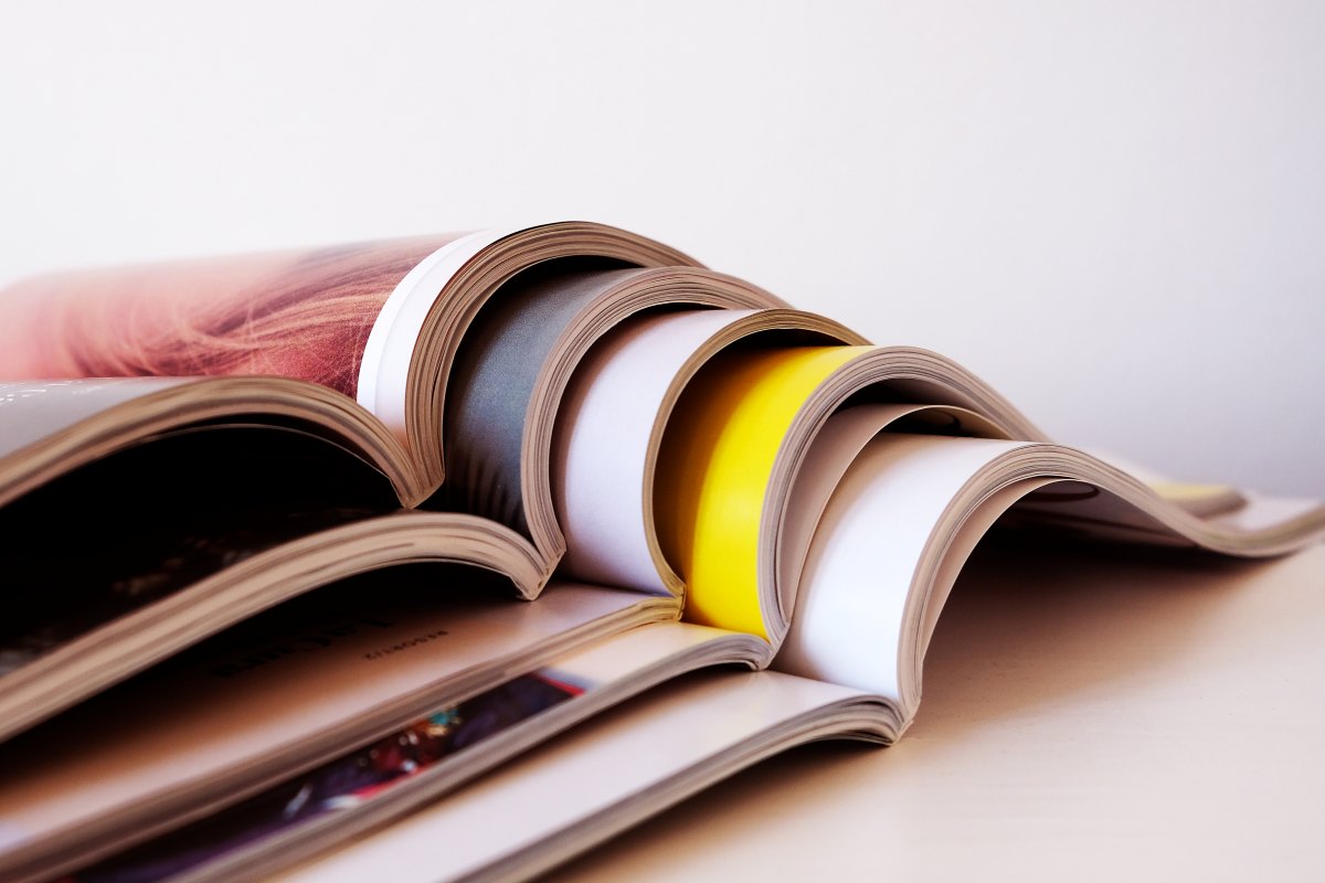 A stack of open magazines