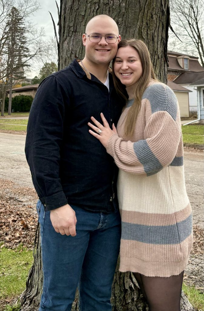 Breanna DeBoer and her husband posing for a photo