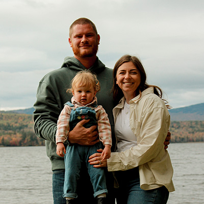 Adreienne Carson with her husband and child